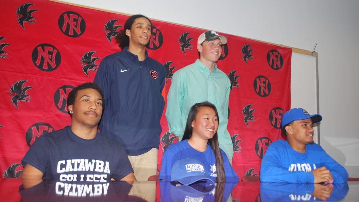 Five members of Nation Ford’s class of 2016 signed to play college sports next year. They are, from left, back row; Cameron Holmes and Cole Martin. Front row, from left; Greg Wilson, Rachel Denney and Tyree Chaplin.
