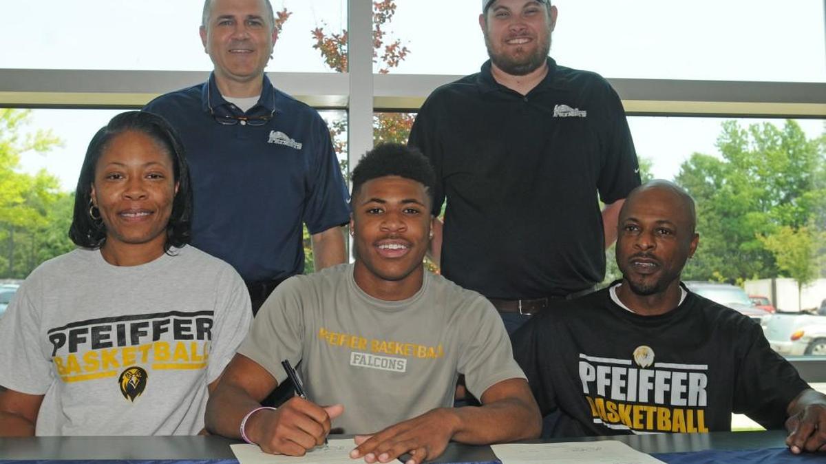 Khali Clegg signed with Pfeiffer Thursday to play basketball. He was joined by (top) York Prep basketball coach Frank Hamrick and York Prep AD Curtis Mitcham, and his parents, Rosalind Able and Carl Clegg.