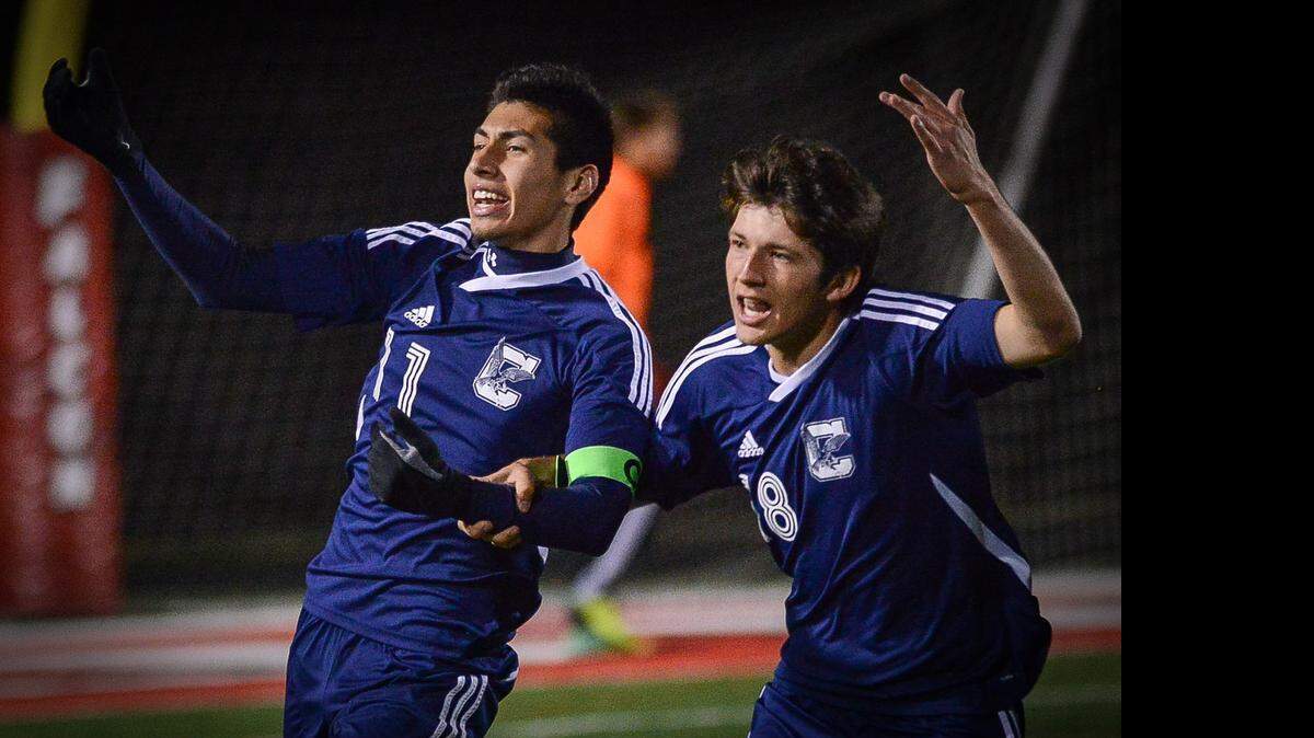 
Clover’s Fernando Alpizar Ramos, left, and Adam Watkins celebrate Ramos’ goal for the first score of the game during the first half Friday night in boys varsity soccer action against Nation Ford.
