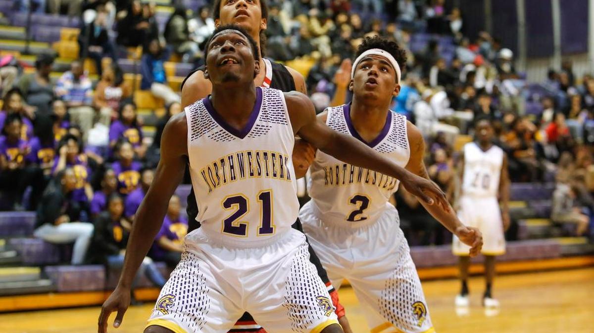Northwestern's No. 21 Jaquarius Clowney gets position on Nation Ford's No. 2 Cameron Holmes as Northwestern hosts Nation Ford in boys varsity basketball, Friday 2-5-2016.