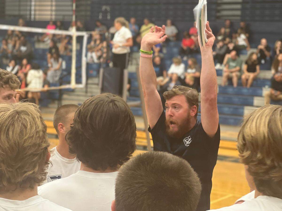 Plyler talks to his varsity squad during a timeout in the first second set of Clover’s boys volleyball match against Dorman on Sept. 12. Dorman swept the Blue Eagles 25-16, 25-11, 25-18 in the varsity match.