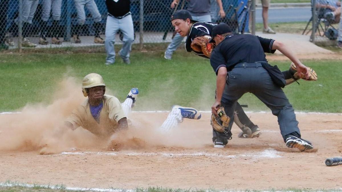 Lewisville's #10 Quentin Sanders slides safely into home plate as Lewisville hosts Lamar in an Upper State baseball elimination game Monday, 5-9-2016.