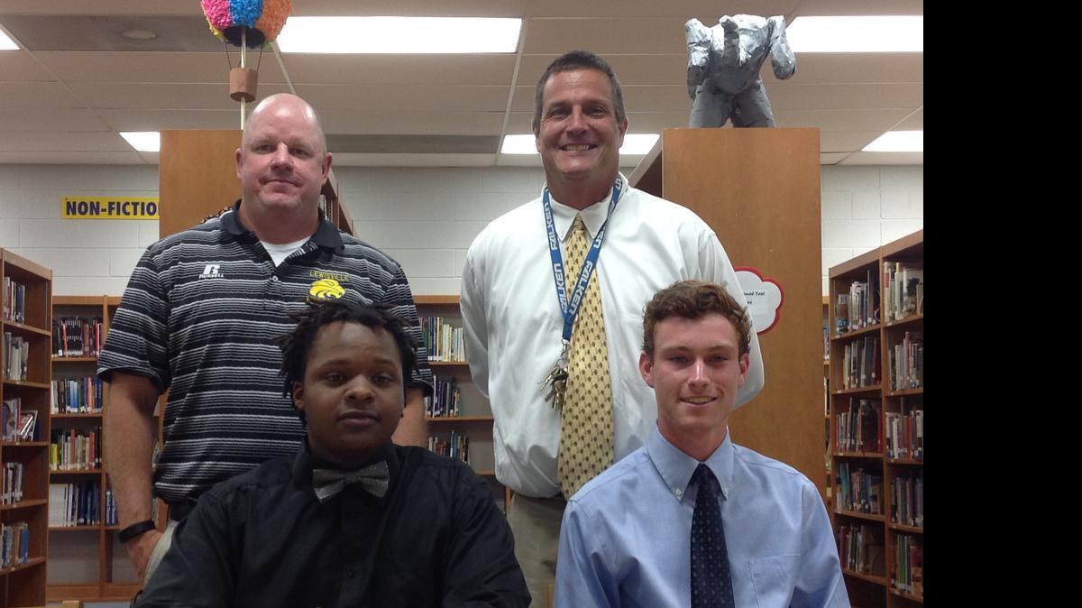 
Lewisville athletes Tyrone McCullough and Austin Bradshaw signed National Letters of Intent Thursday at the school’s media center. McCullough - pictured with Lewisville football coach Will Mitchell (left) - will play football at Orangeburg Calhoun Tech, while Bradshaw - shown with baseball coach Billy Keels - will play baseball at USC Salkehatchie.
