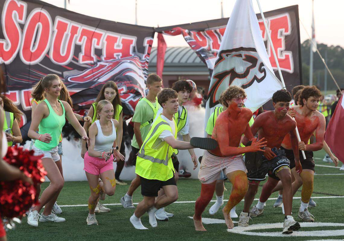South Pointe HIgh School students run on the field before the game against West Charlotte Friday, Sept. 5, 2025 in Rock Hill, S.C.