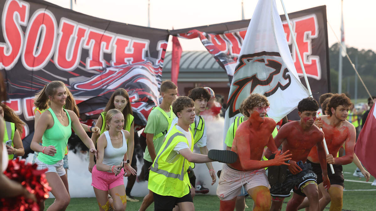 South Pointe HIgh School students run on the field before the game against West Charlotte Friday, Sept. 5, 2025 in Rock Hill, S.C.