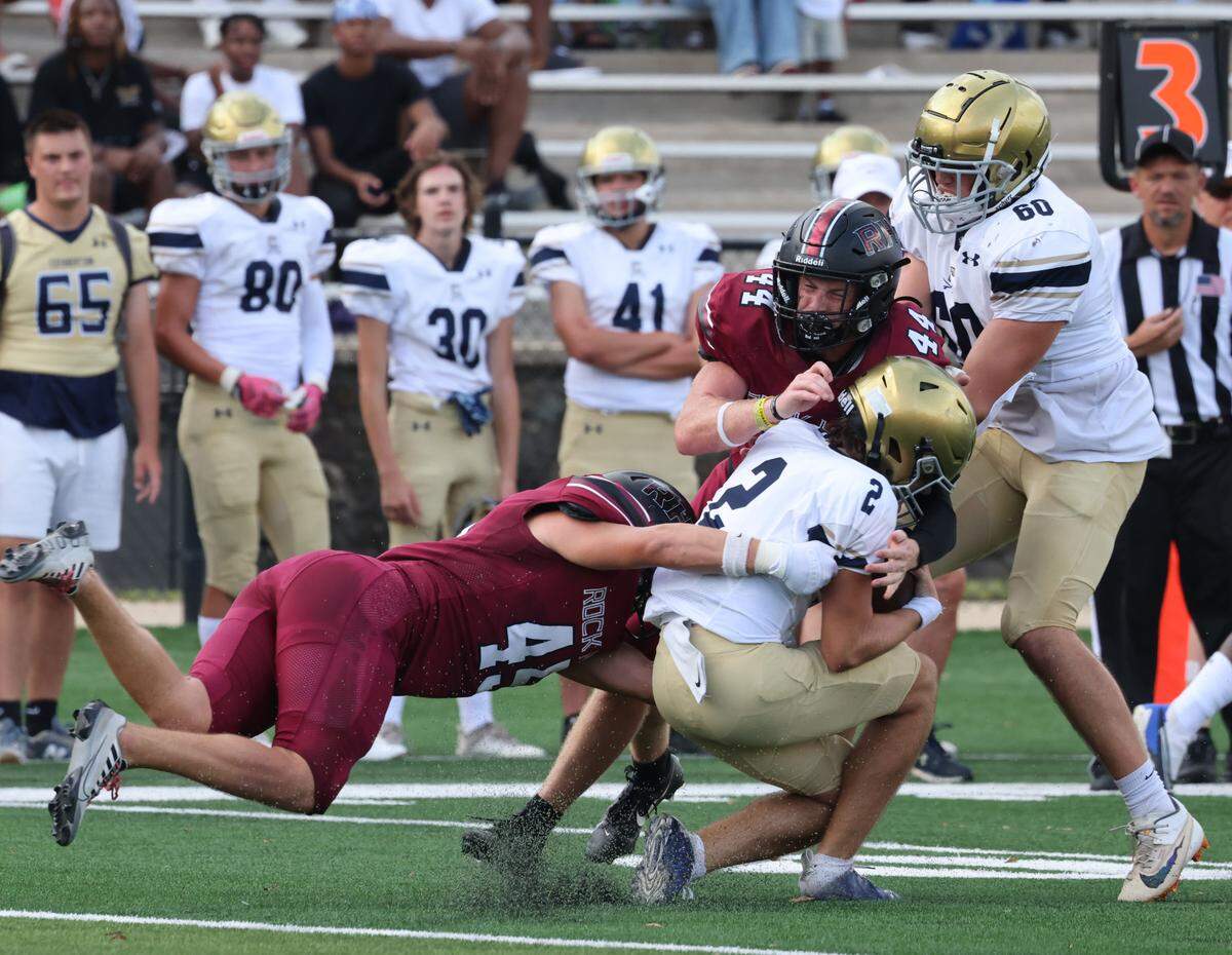 Rock Hill’s Landon Armstrong (45) and Isaiah Palmer (44) bring down Cuthbertson’s Zach Eichelberger Friday, Aug. 11, 2023.