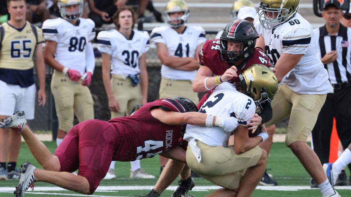 Rock Hill’s Landon Armstrong (45) and Isaiah Palmer (44) bring down Cuthbertson’s Zach Eichelberger Friday, Aug. 11, 2023.