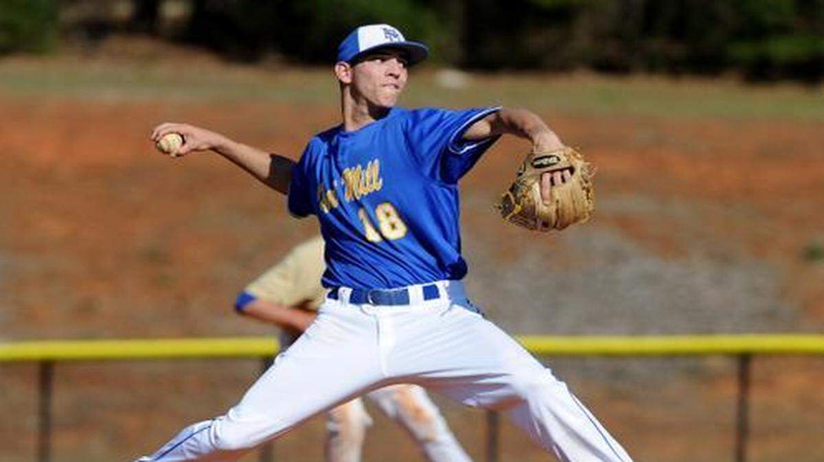 
Fort Mill's pitcher Clay Helvey on the mound against Lewisville in the Wheels Baseball Invitational.
