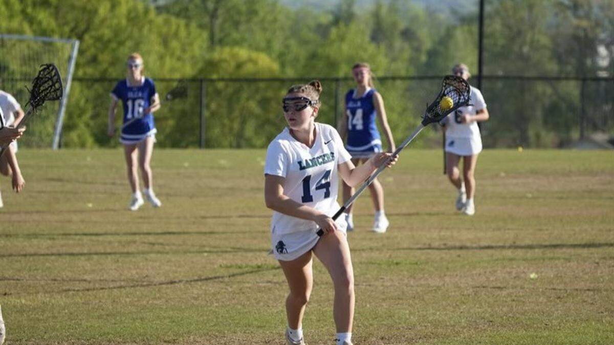 Morgan Savage (white, 14) had 13 points this season with eight goals and five assists.