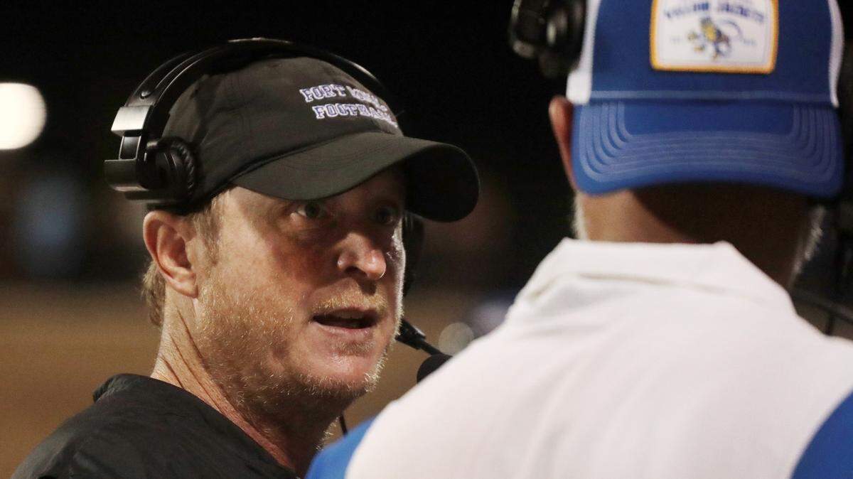Fort Mill High varsity football coach Rob McNeely, left, has a new message for his players as they approach the 2022 season.