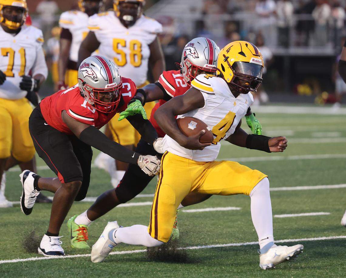 West Charlotte's Jamouri Nichols carries the ball, followed by South Pointe's Jasiah Lewis (13) and Daquan Evans (12) Friday, Sept. 5, 2025 in Rock Hill, S.C.