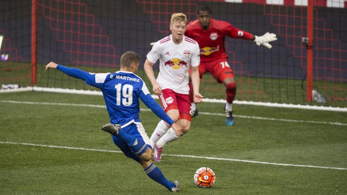 Charlotte Independence’s Enzo Martinez, a Northwestern standout, sends his shot into the goal on Sunday in New York. It was his third goal in the past three games, all Independence wins.