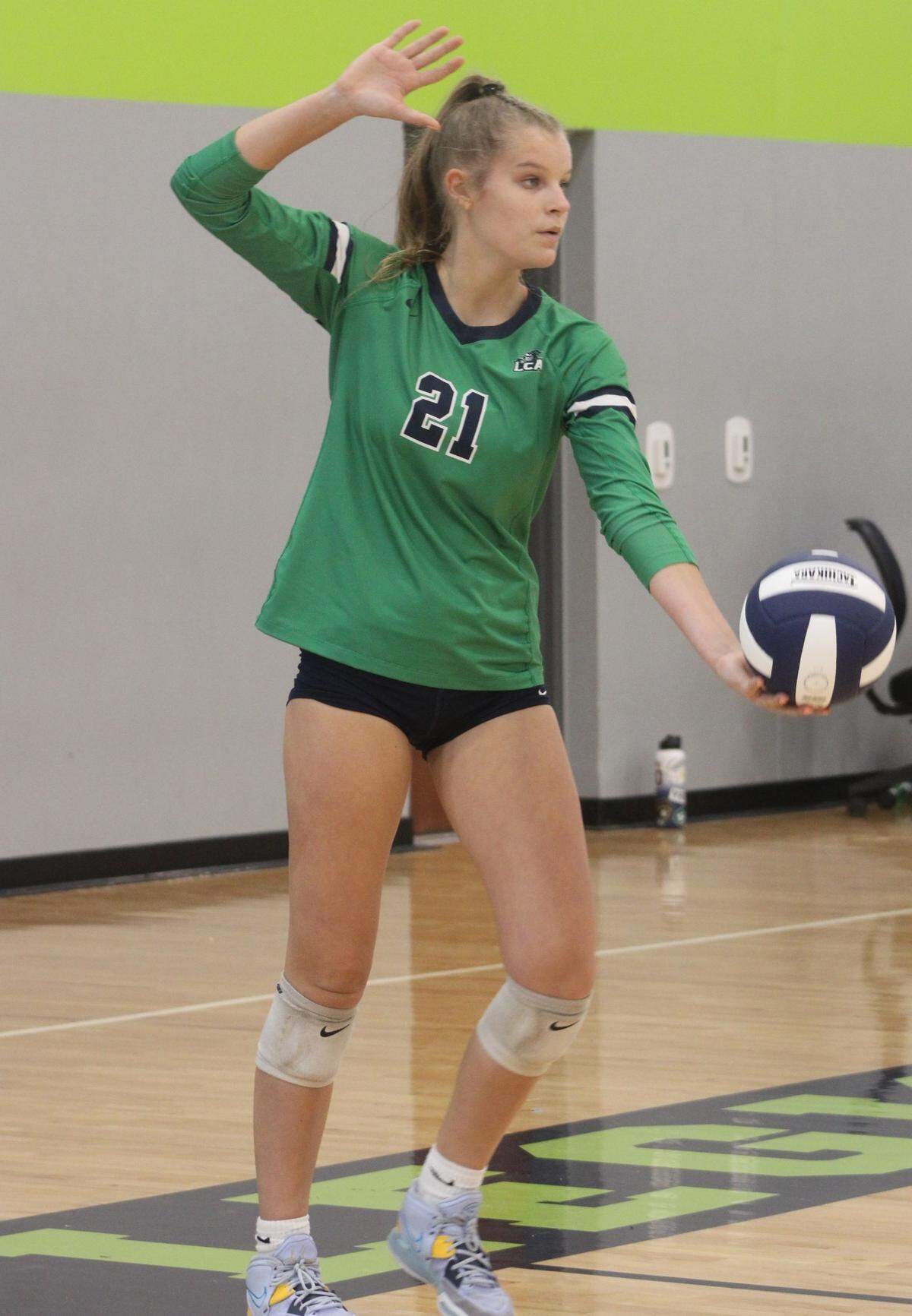 Burke, a sophomore, goes for a serve. Burke has 50 aces on the season.