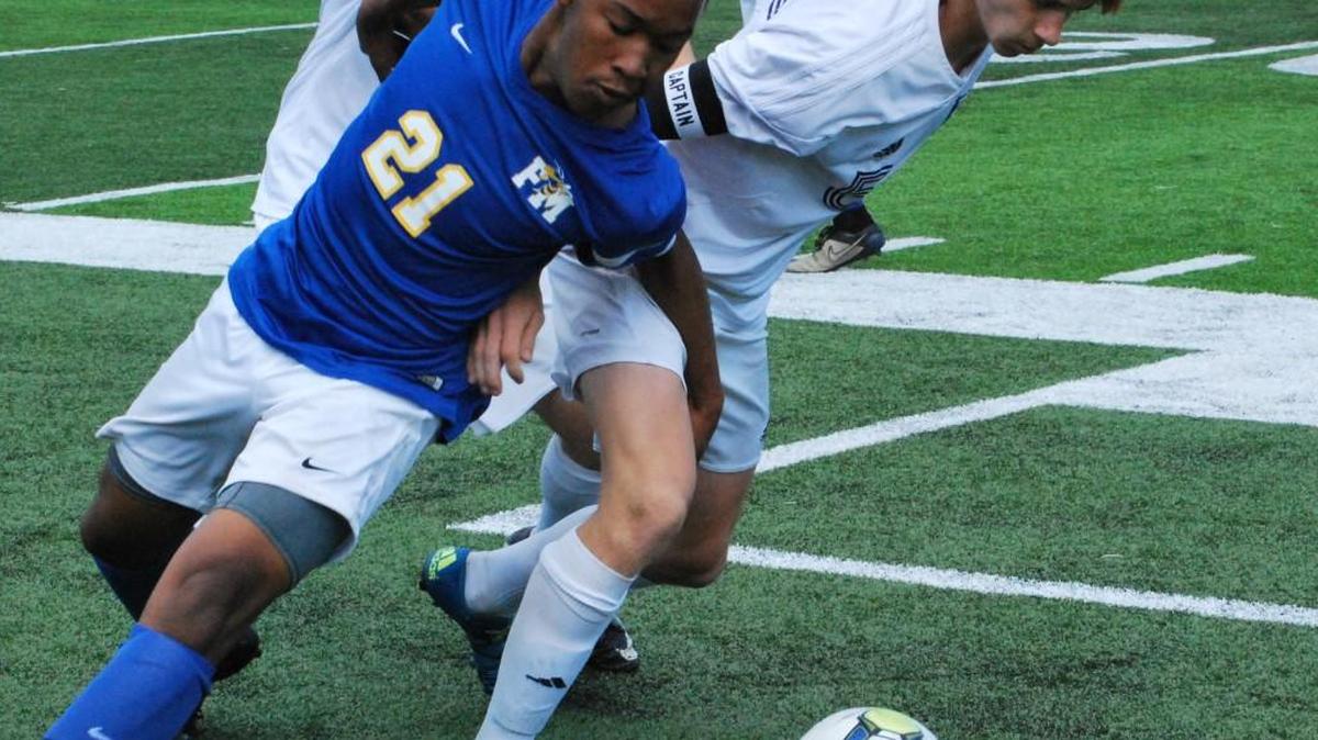 Clover’s Dylan Jones and Fort Mill’s Aaron Koch battle for the ball during their team’s third round 4A state soccer playoff game Saturday.