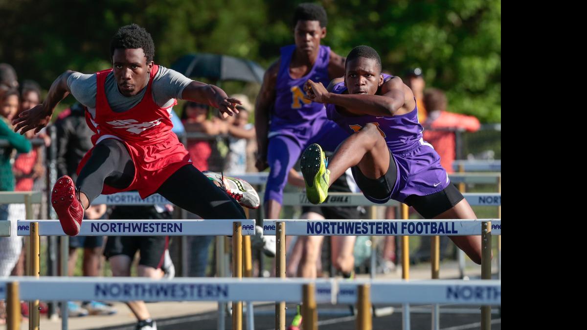 
South Pointe's Justin Douglas and Northwestern's Noah Walker battle in the boys 110 meter hurdles as Northwestern high school hosts the York County Track and Field championship.
