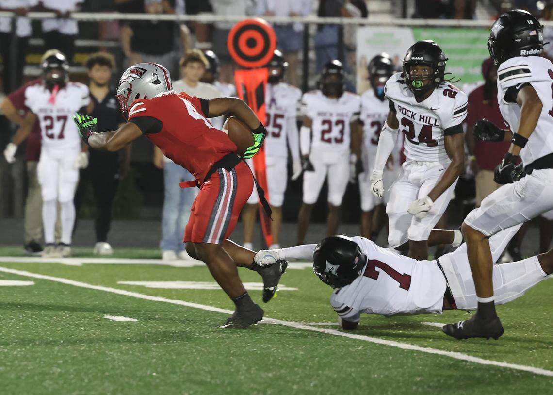 South Pointe's R.J. Brown runs past Rock Hill's Nigel Lightner Friday, Sept. 29, 2025