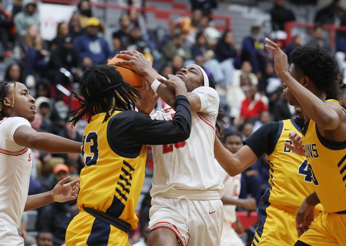 South Pointe’s R.J. Hill fights for control of the ball with Lancaster’s Zach Graham Tuesday in Rock Hill, S.C.