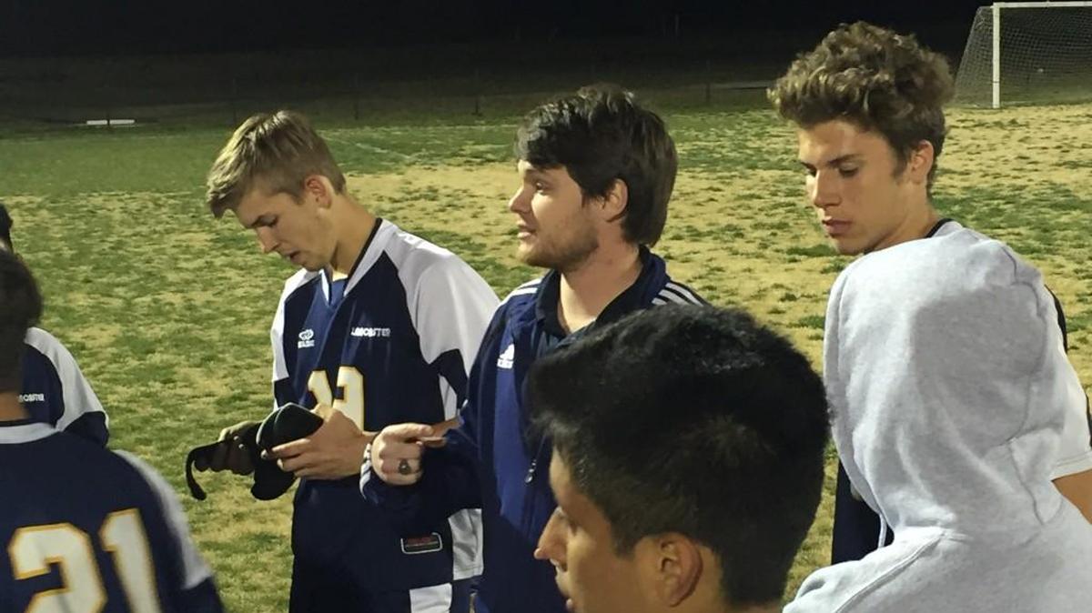 Lancaster coach Adam Nelson addresses his team following the Bruins’ 1-0 win over South Pointe Tuesday night.