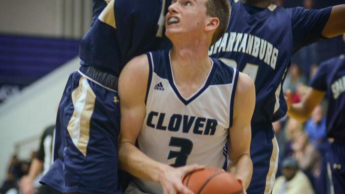 Clover’s Andrew White (3) works against two Spartanburg defenders on Wednesday.