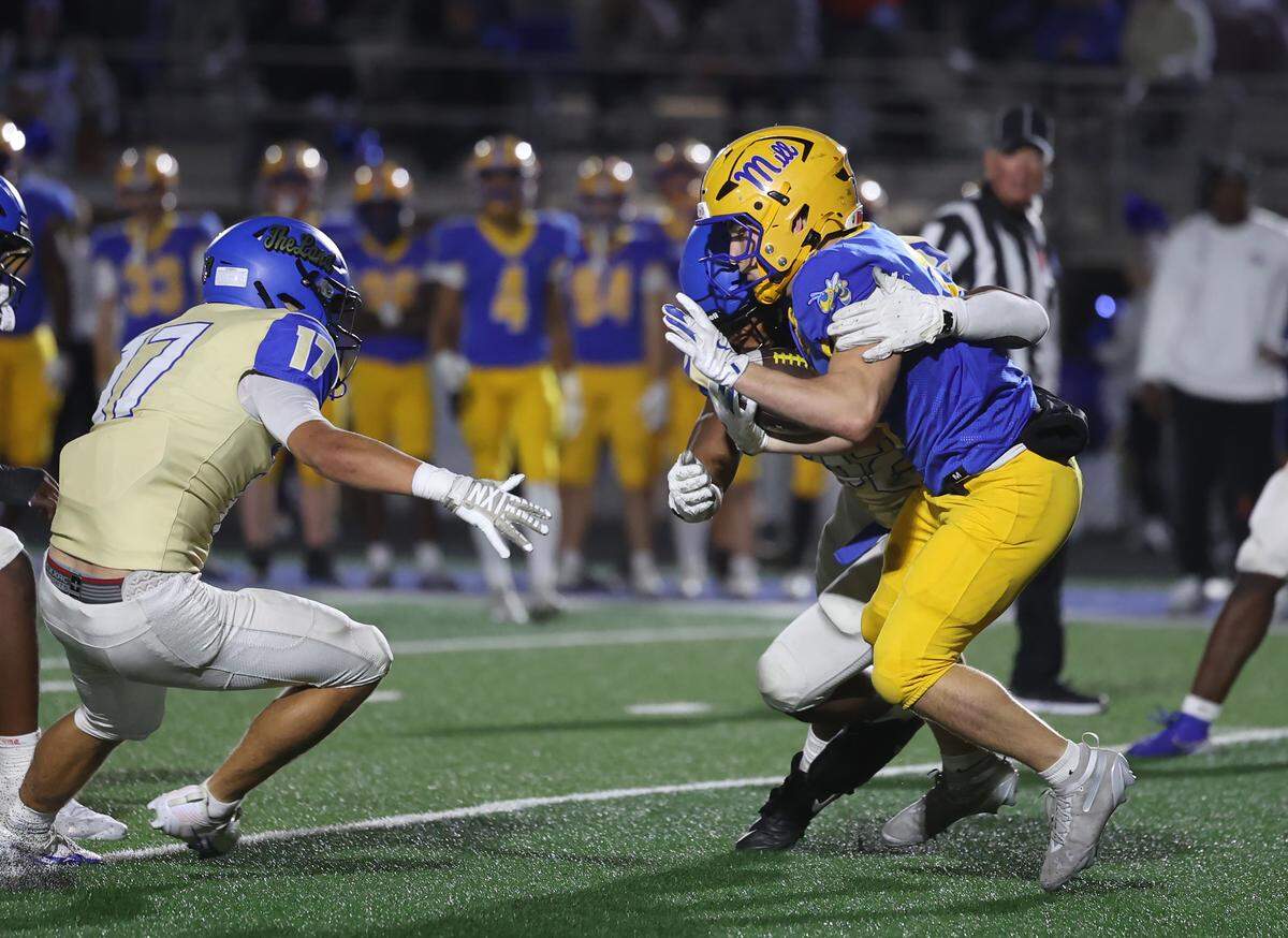 Fort Mill's Broden Mitcheson is stopped by Indian Land's Michael Foster as Ty Fallecker (17) tries to stop him Friday, Oct. 23, 2025 in Fort Mill, S.C.