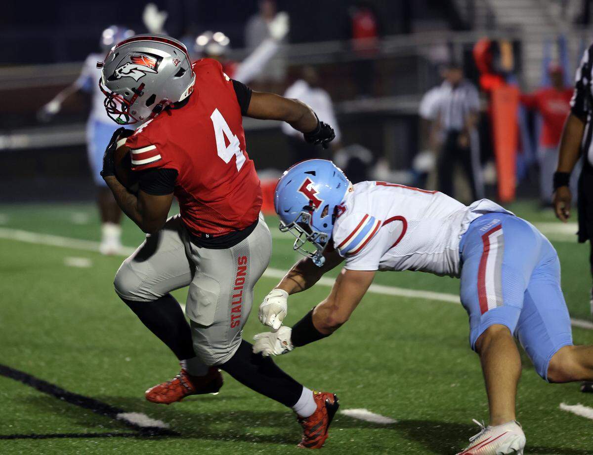South Pointe High School's R.J. Brown heads to the end zone for a touchdown as A.C. Flora High School's tries to stop him Friday, Nov. 21, 2025 in Rock Hill, S.C.