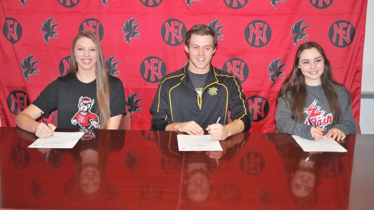 Nation Ford signees, from left, Jessica Kemp, Drake Durham and Marlo Vandiver, all signed with different colleges Wednesday at the school.