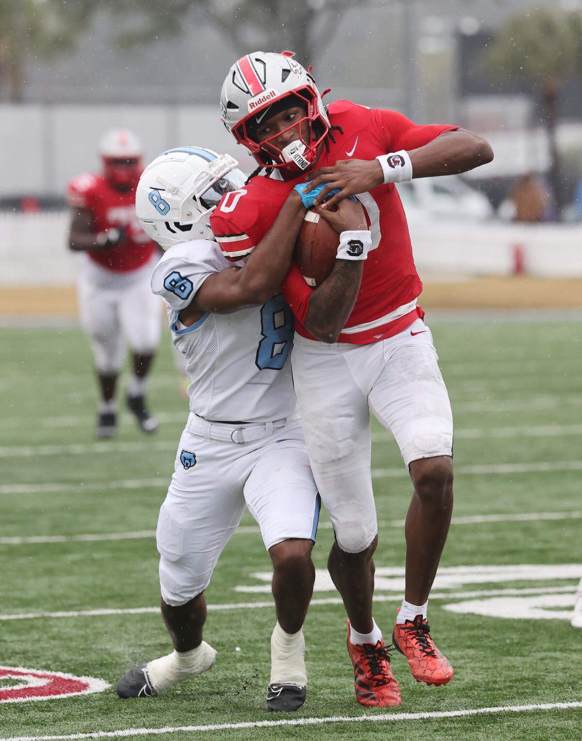 South Florence's Will Wilson attempts take South Pointe's J'zavein Currence during the first half of the SC High School League Class 4A football championship