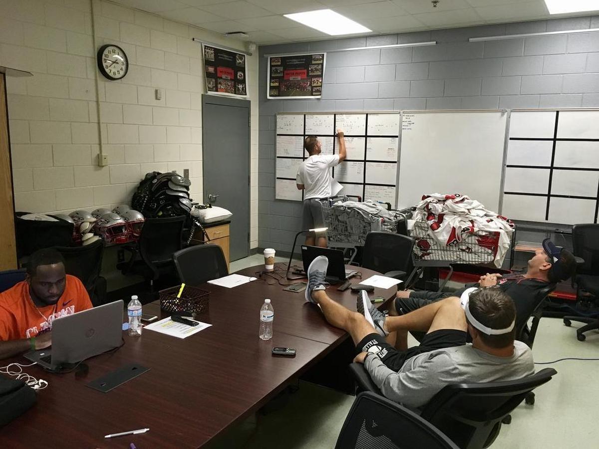 South Pointe offensive coaches meetings are a democratic activity. Offensive coordinator Jason McManus readily takes suggestions and notes from the three other coaches in the room.