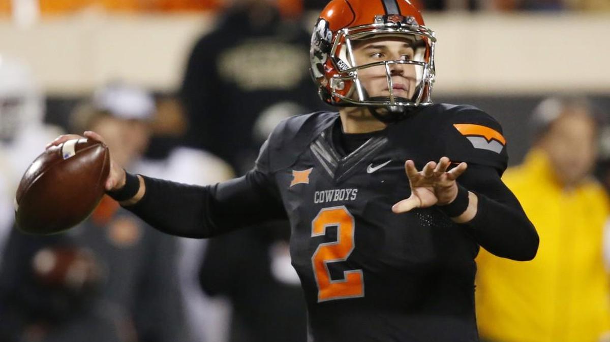Oklahoma State quarterback Mason Rudolph looks to throw during the third quarter of an NCAA college football game against Baylor in Stillwater, Okla., Saturday, Nov. 21, 2015. Baylor won 45-35.