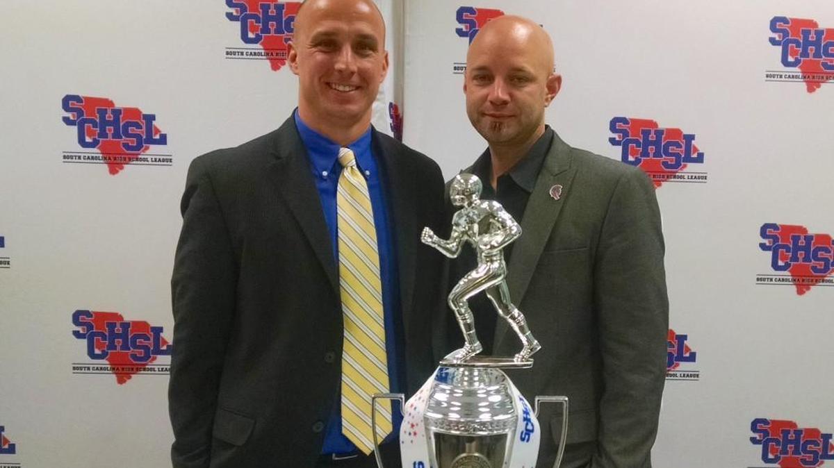 Northwestern coach Kyle Richardson (right) - pictured with Lexington coach Josh Stepp - joked that Monday’s 4A Division II state championship press conference was sponsored by Head and Shoulders shampoo.