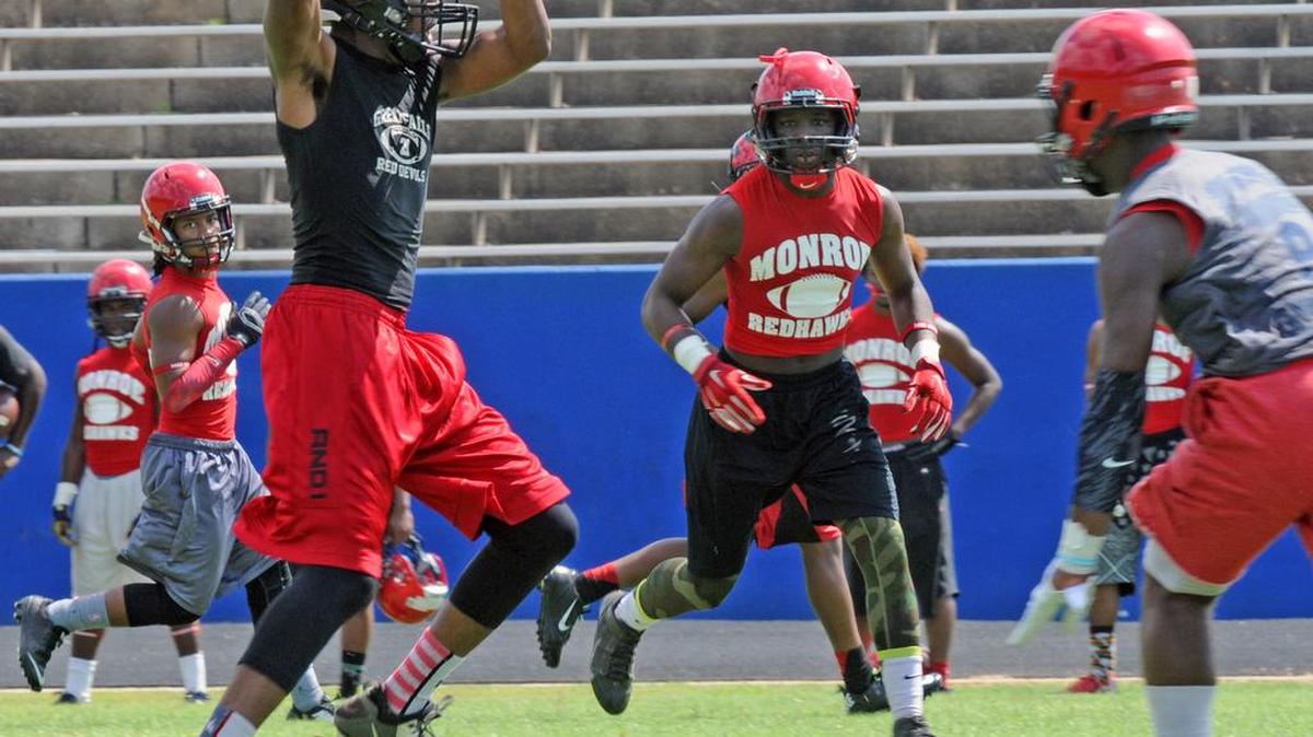 
Great Falls' Raheem Bowers makes a grab during a 7-on-7 tournament this summer. Bowers and other seniors will need to step up their games for the Red Devils this fall.
