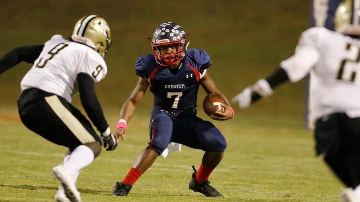Chester quarterback John Erby tries to escape from Fairfield Central defenders.
