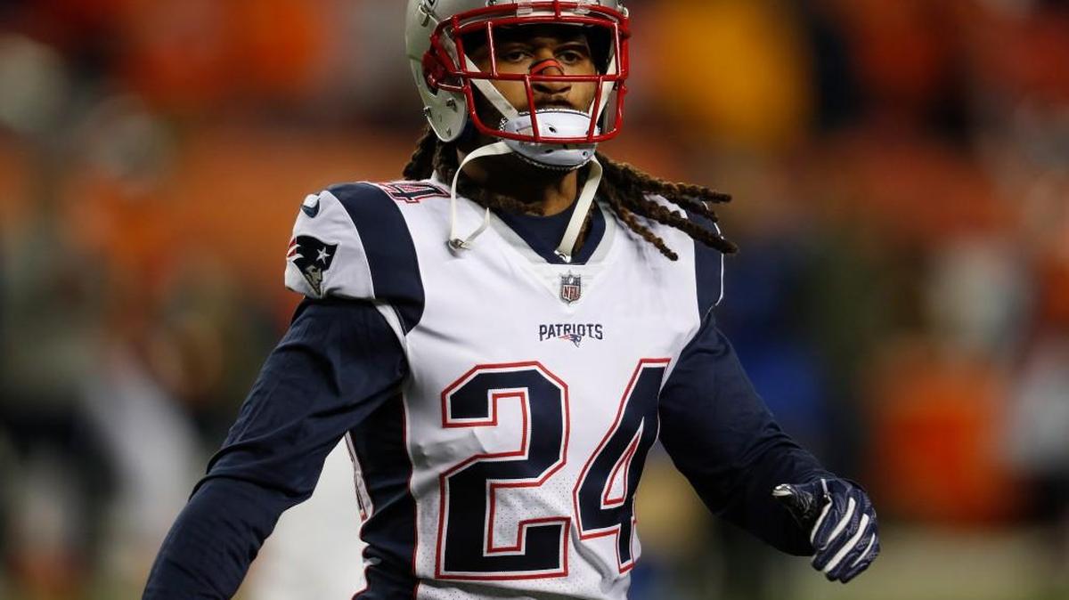 New England Patriots cornerback Stephon Gilmore (24) warms up prior to an NFL football game against the Denver Broncos, Sunday, Nov. 12, 2017, in Denver.