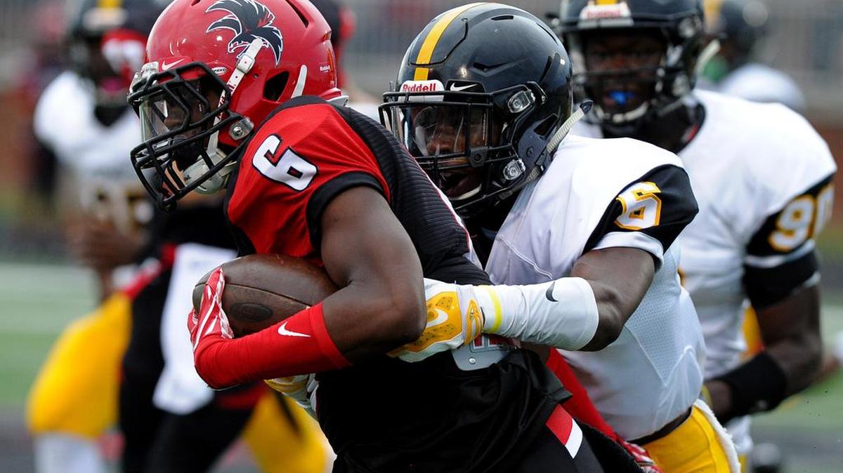 Irmo's Zafir Kelly (6) gets a hold on Montre Miller (6) and takes him down on the run play by Nation Ford.