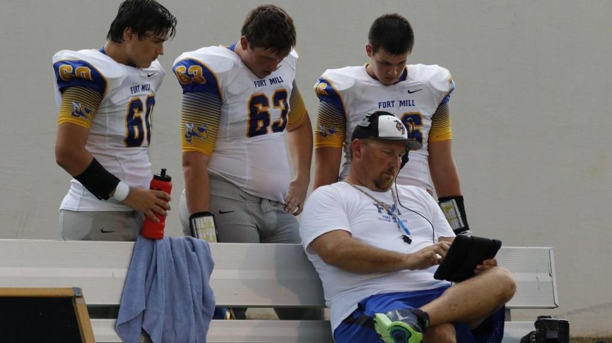 Cam Sponheimer (middle, No. 63) started an online petition encouraging Fort Mill High to hire offensive line and special teams coach Frank Ambrose.