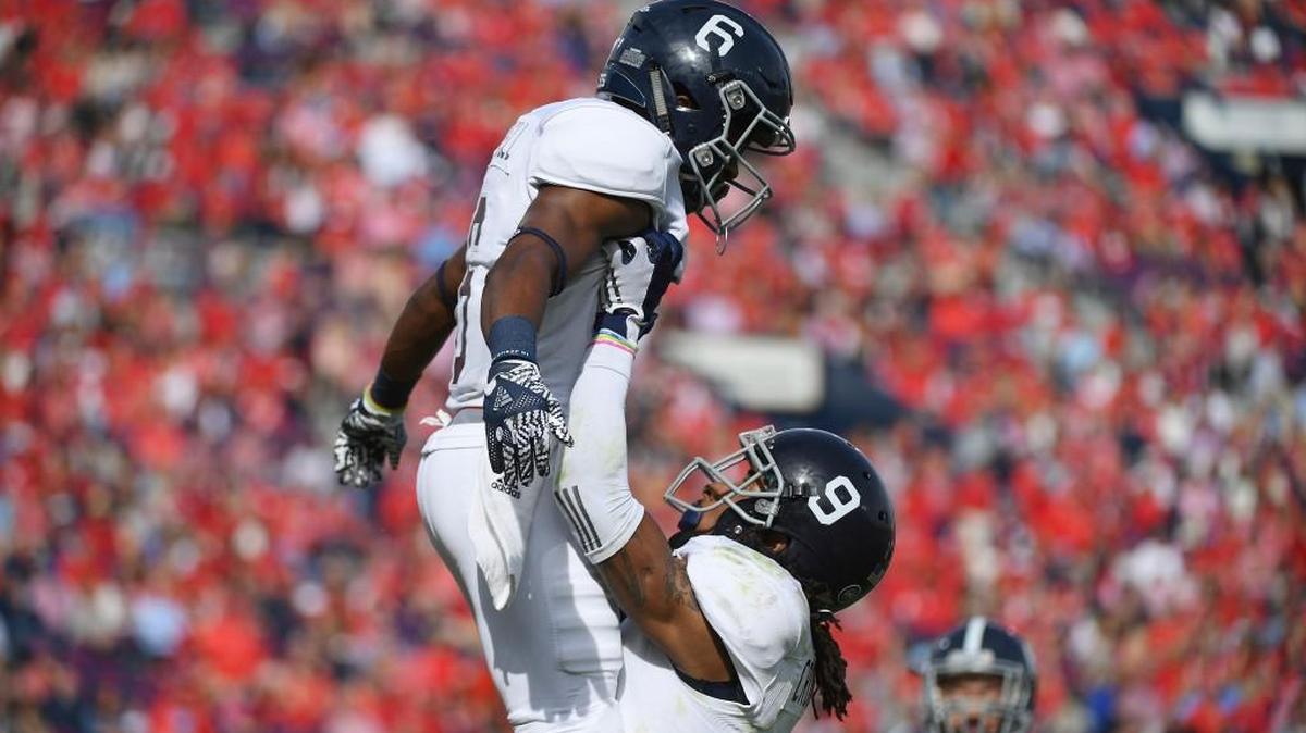 Georgia Southern wide receivers Montay Crockett (9) and Myles Campbell (6) celebrate after Campbell's touchdown during the first quarter of an NCAA college football game in Oxford, Miss., Saturday, Nov. 5, 2016.