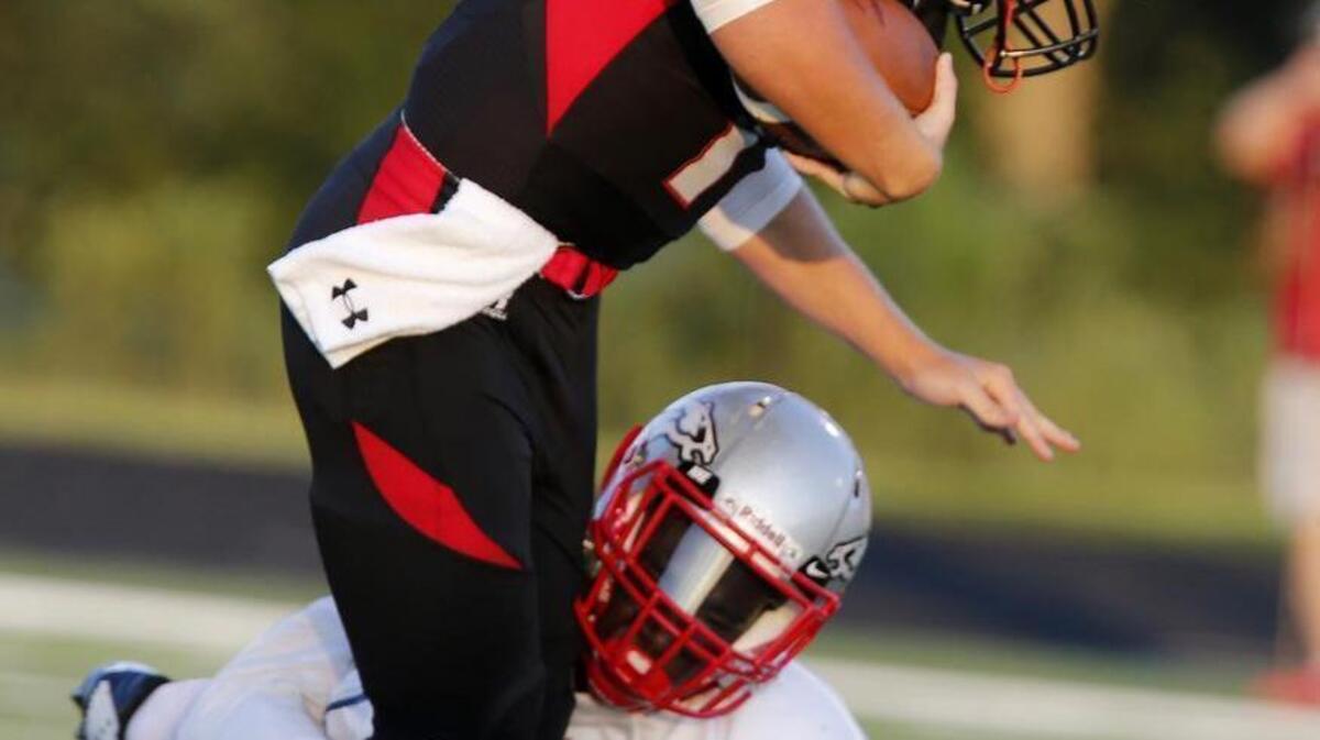 
Nation Ford High School hosts South Pointe High August 21, 2015. Nation Ford quarterback Cole Martin (11) is taken down by South Pointe's Derion Kendrick.
