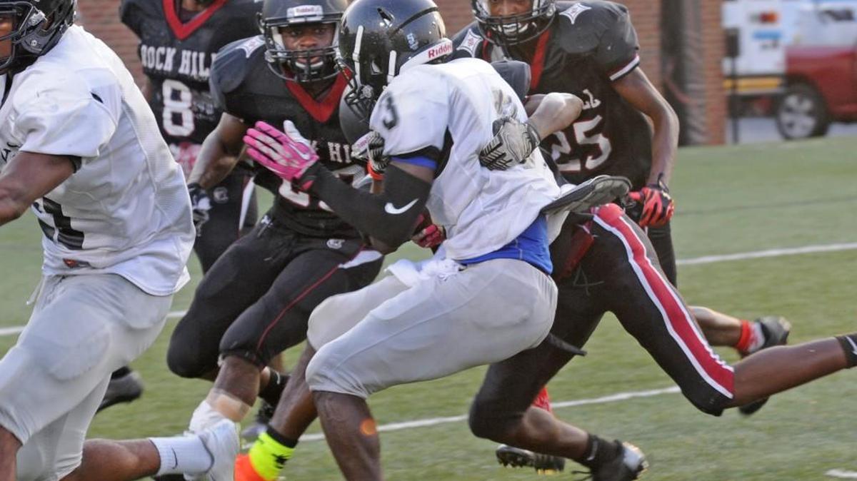 
Rock Hill defenders line up four deep to make a play Thursday evening during a scrimmage against Hough.
