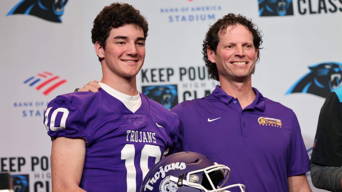Northwestern quarterback Finley Polk, left, and football coach Page Wofford attend a news conference Monday to announce Northwestern will play Charlotte Providence Day School Chargers in the inaugural Keep Pounding High School Classic at Bank of America Stadium on Aug. 19.