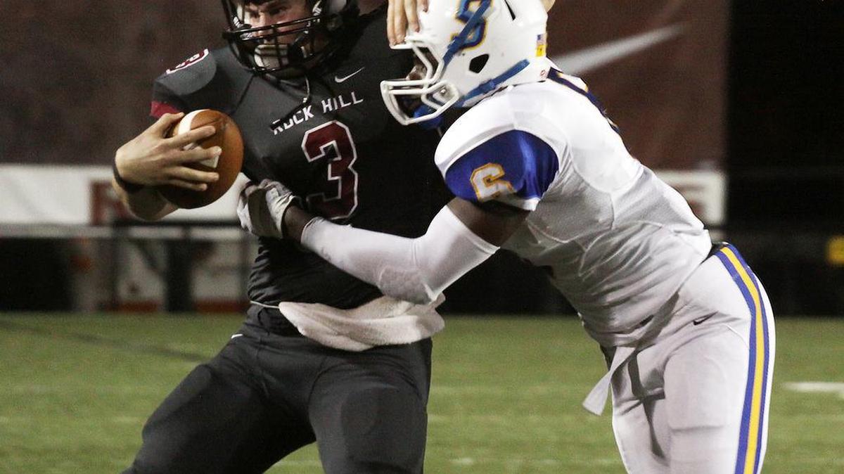 
Rock Hill’s Brandon Banks is brought down by Sumter’s Raymond Johnson Friday night at District Three Stadium.
