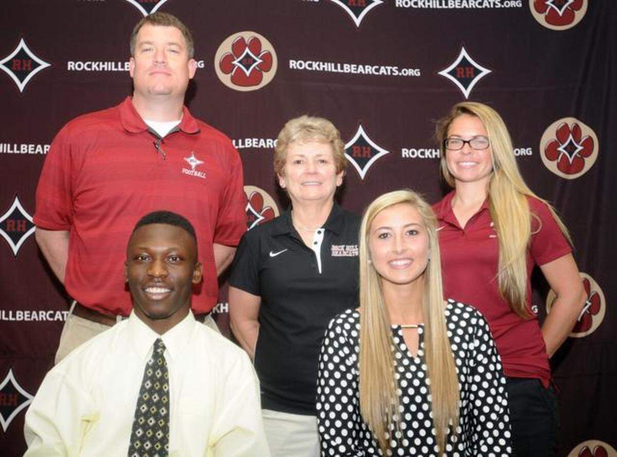 Cindy Elder (top row, middle) coached several players who went on to play volleyball players in college. This Herald file from 2015 photo shows Bayley Hinson (bottom right) signing to play volleyball at USC Lancaster. Others in photo: Deshaun McFadden (left), Rock Hill football coach Bubba Pittman (top row, left) and softball coach at the time, Alisha Waldrop (top row, right).
