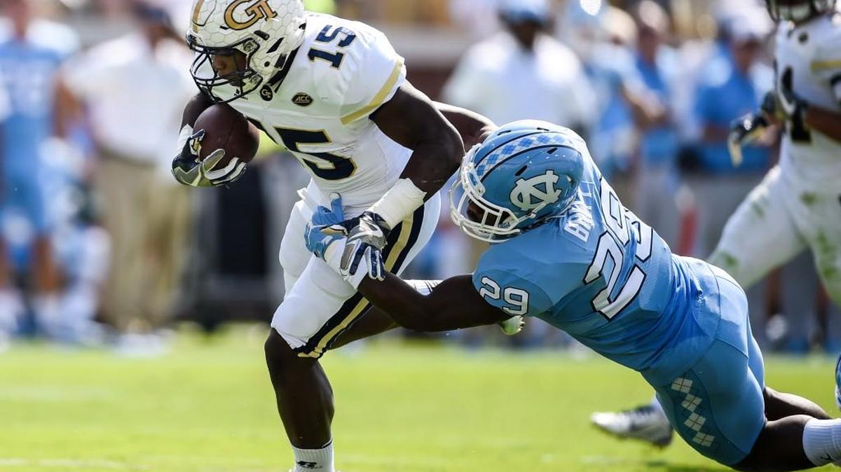 North Carolina safety J.K. Britt (29) tackles Georgia Tech running back Jerry Howard (15) during the first half of an NCAA college football game, Saturday, Sept. 30, 2017, in Atlanta.