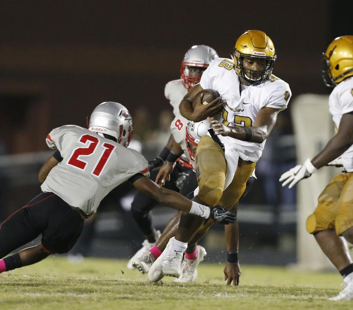 South Pointe’s Savion White (#21) dives for a tackle in 2018, his senior season.