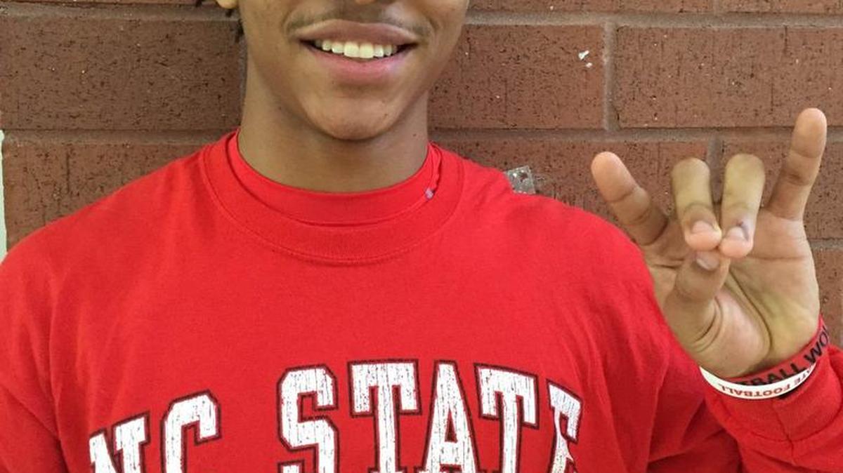 South Pointe standout Nick McCloud makes the Wolfpack hand signal after committing to North Carolina State University.