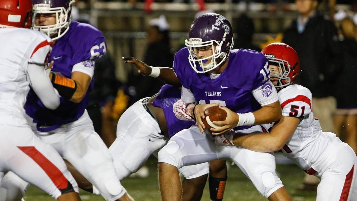 Northwestern quarterback No. 15 Gage Moloney carries the ball as Northwestern hosted South Mecklenburg at District 3 Stadium Friday, 9-2-2016.