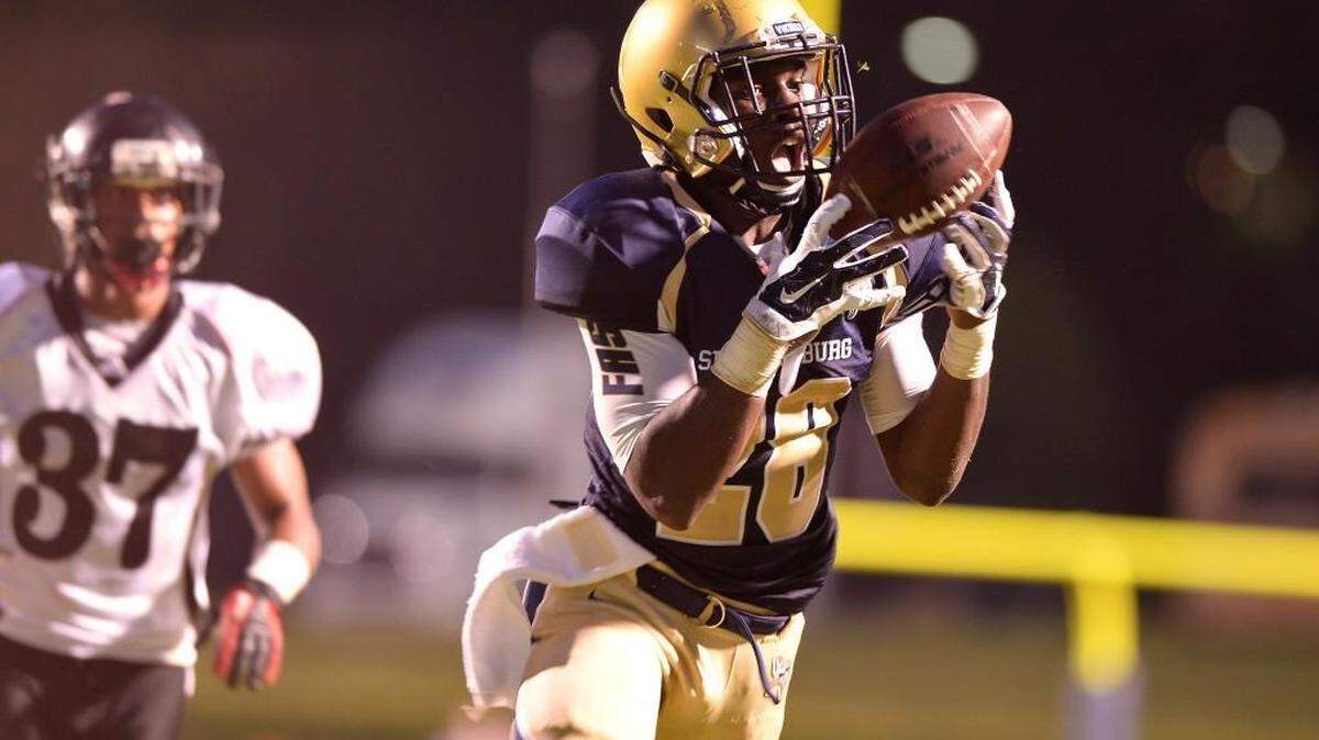 Spartanburg’s Tavien Feaster (28) reaches for the ball in the endzone against Eastern Christian Academy, at Wofford’s Gibbs Stadium in Spartanburg, Friday night, 8/22/2014.