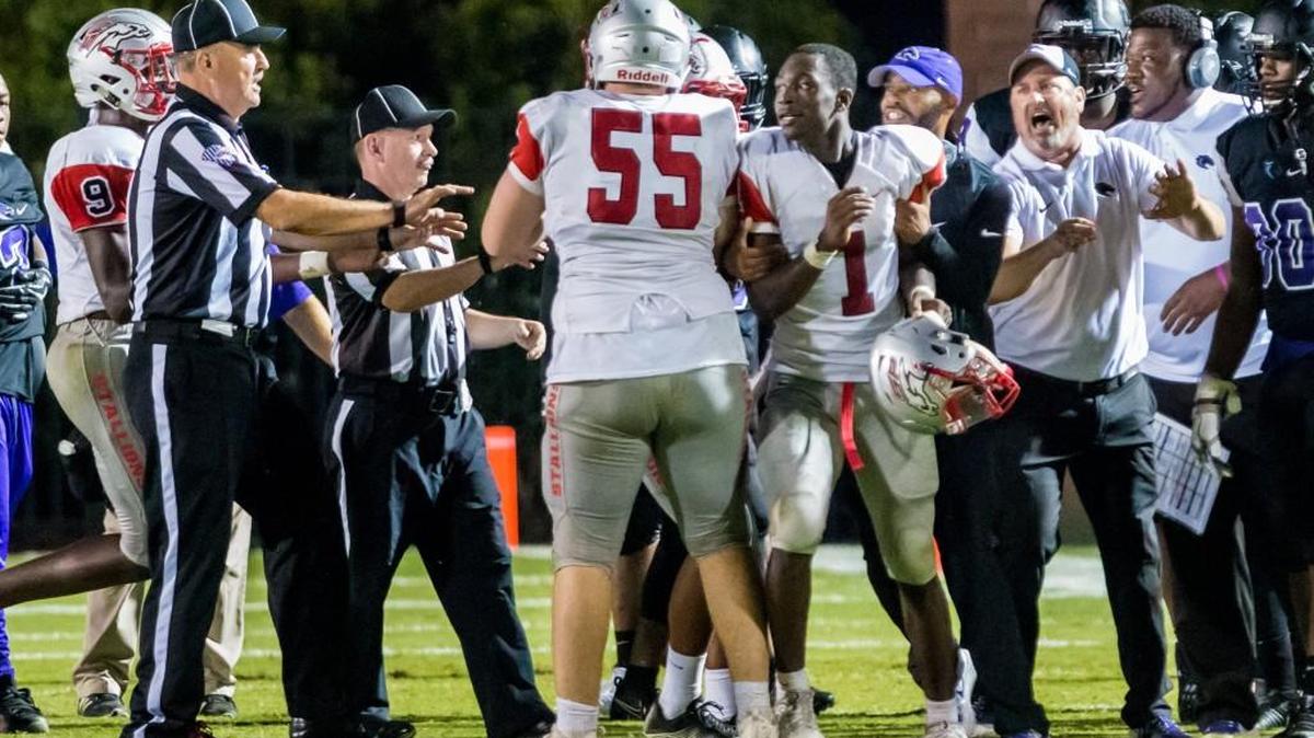 South Pointe Stallions and Ridge View Blazers players are separated during an altercation in the game between South Pointe High School and Ridge View High School Sept. 28 in Blythewood.