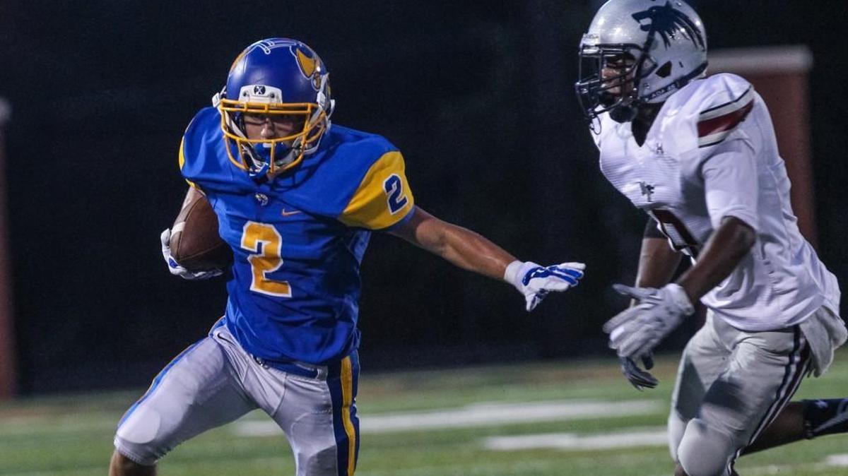 
Fort Mill's Gus Jarosz (2) heads upfield after a catch during the Yellow Jackets’ win over White Knoll at the Battle on the Bluff in Lexington Thursday.
