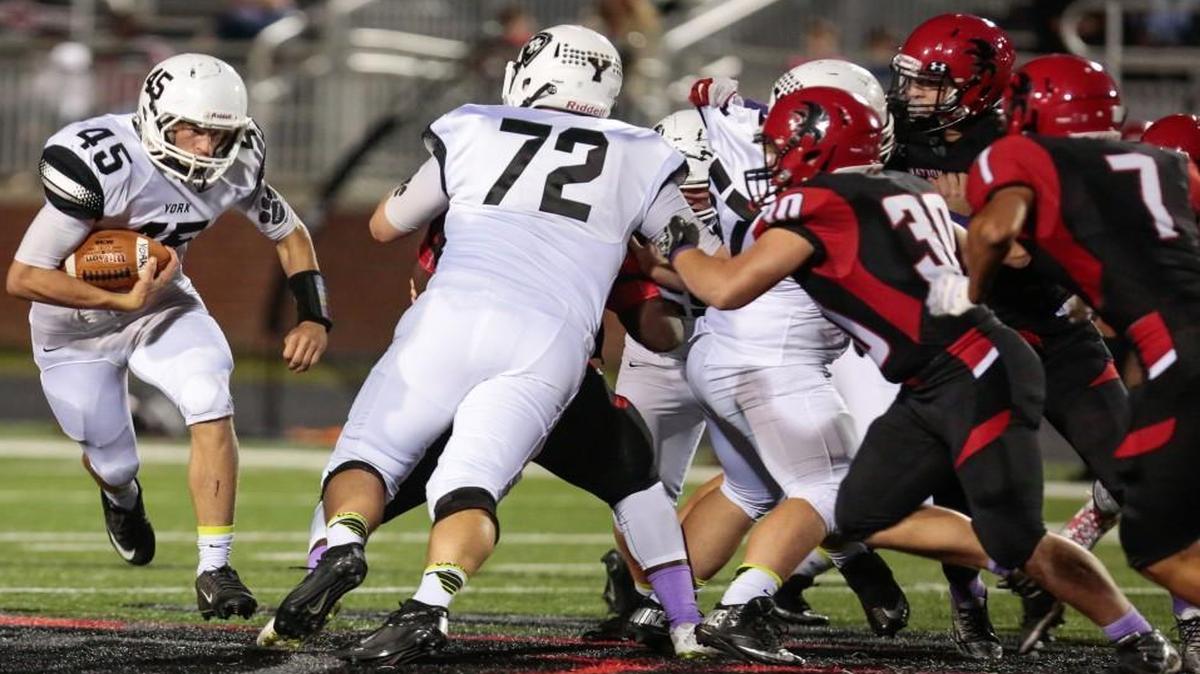 
York's Brandon Garvin carries the ball as the Nation Ford Falcons host the York Cougars in Friday night football.
