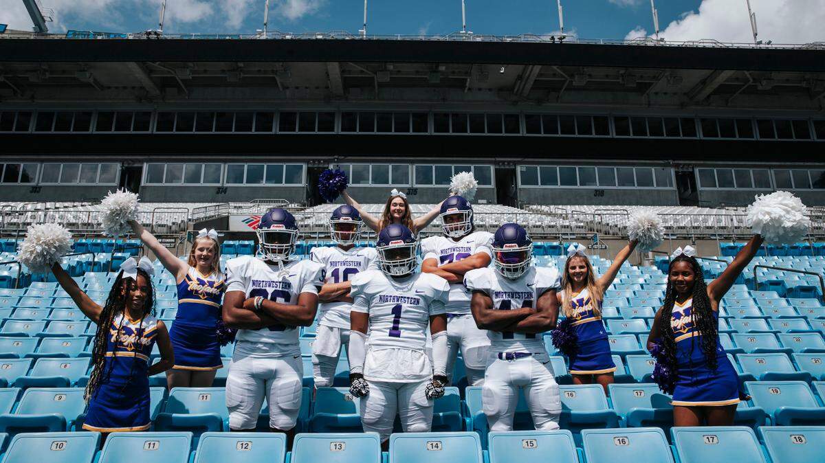 Trojans football players and cheerleaders pose during their media day session held at Bank of America Stadium earlier this year.